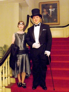 Dancers pose in 1920s formalwear