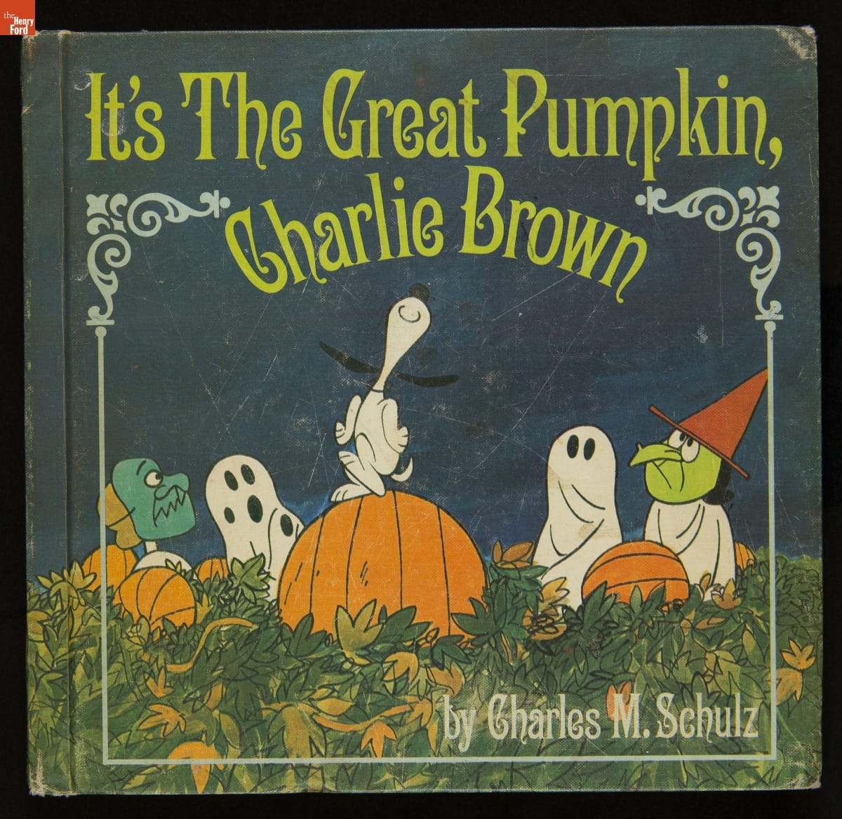 It's The Great Pumpkin, Charlie Brown, 1967 Book cover with text and image of Snoopy dancing on a pumpkin in a field with other characters in Halloween costumes nearby