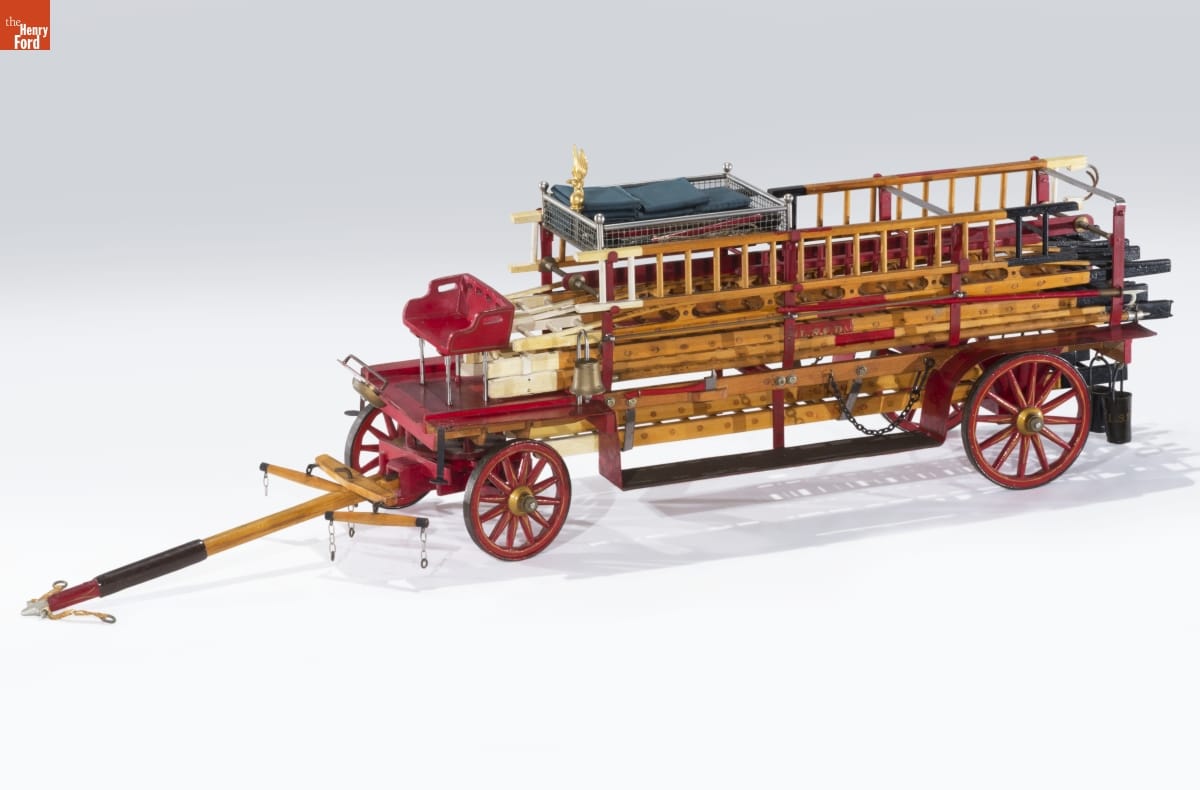 Wooden fire truck with red wheels