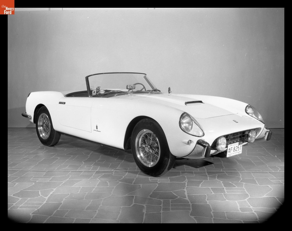 1958 Ferrari California Featured in the "Sports Cars in Review" Exhibition at Henry Ford Museum, 1965 Black-and-white photo of sleek, low convertible with top down parked in a display indoors