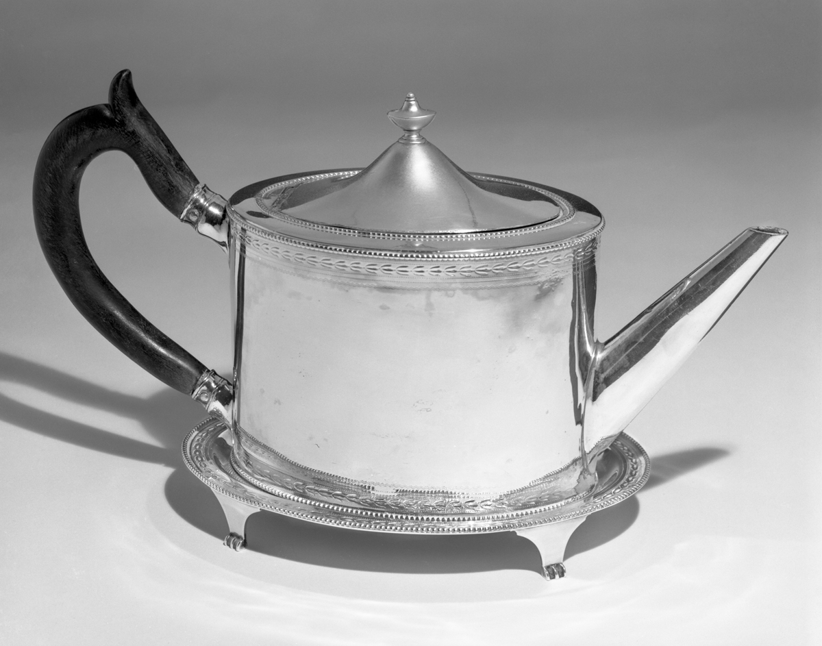 Teapot with Stand, Made for Export, circa 1800 Oval-shaped cylindrical silver teapot with black handle