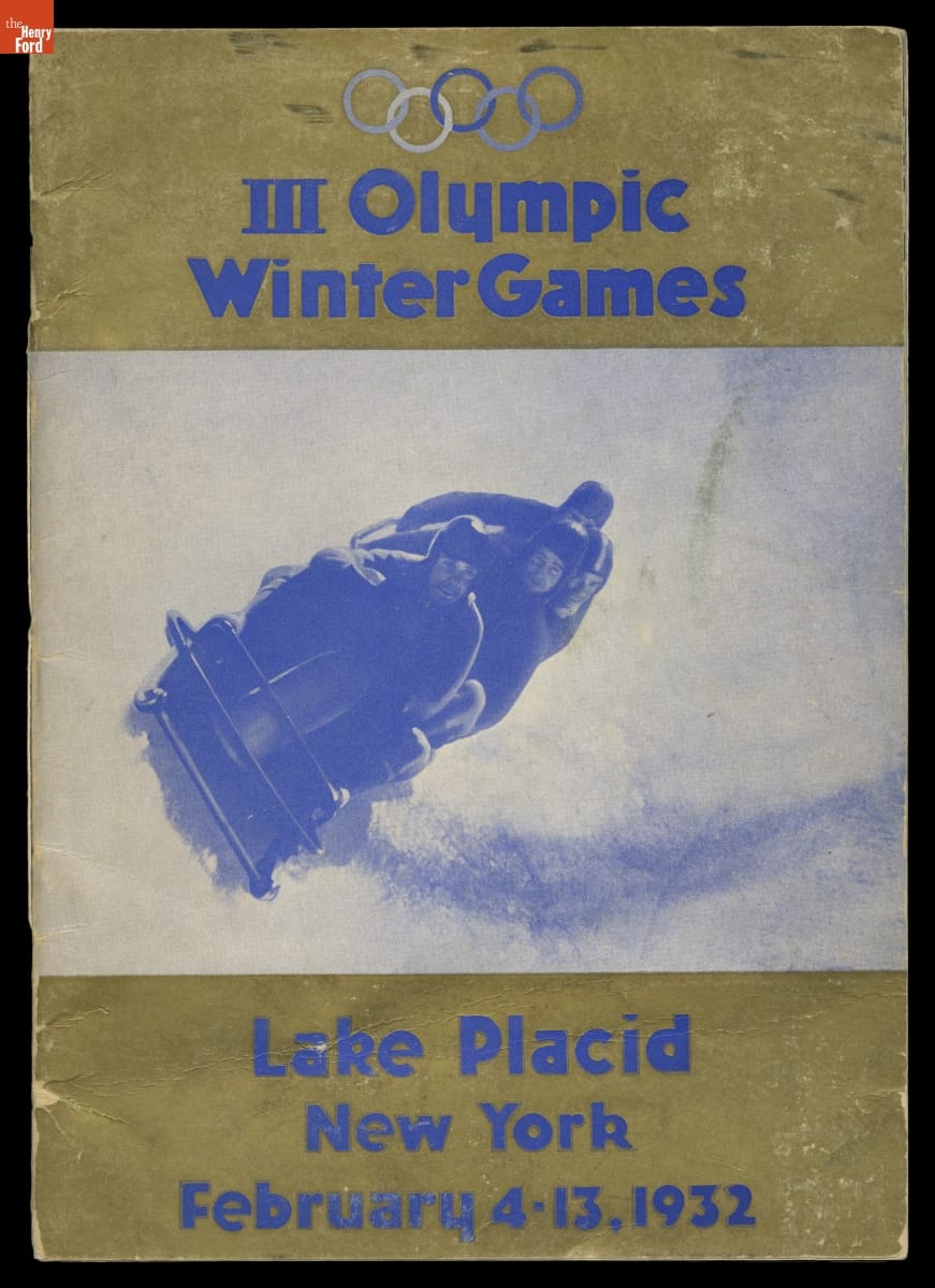 III Olympic Winter Games, Lake Placid, New York, February 4-13, 1932 Gold cover with blue text and blue-and-white image of bobsledding