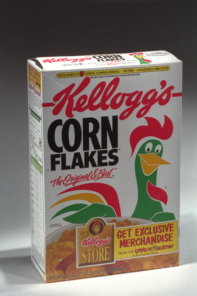 Kellogg's Corn Flakes Breakfast Cereal, circa 1995 White Kellogg’s Corn Flakes box featuring a green and red rooster, c. 1995