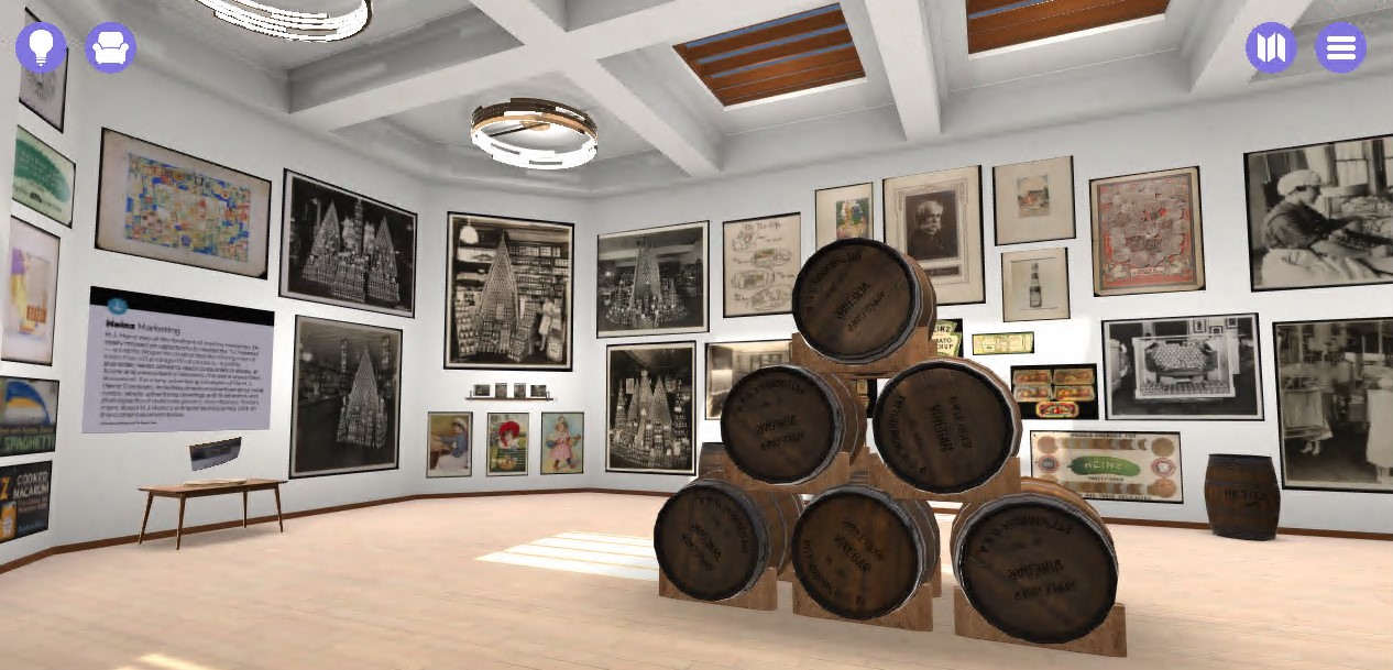 Virtual gallery space with artifacts on walls and a stack of barrels