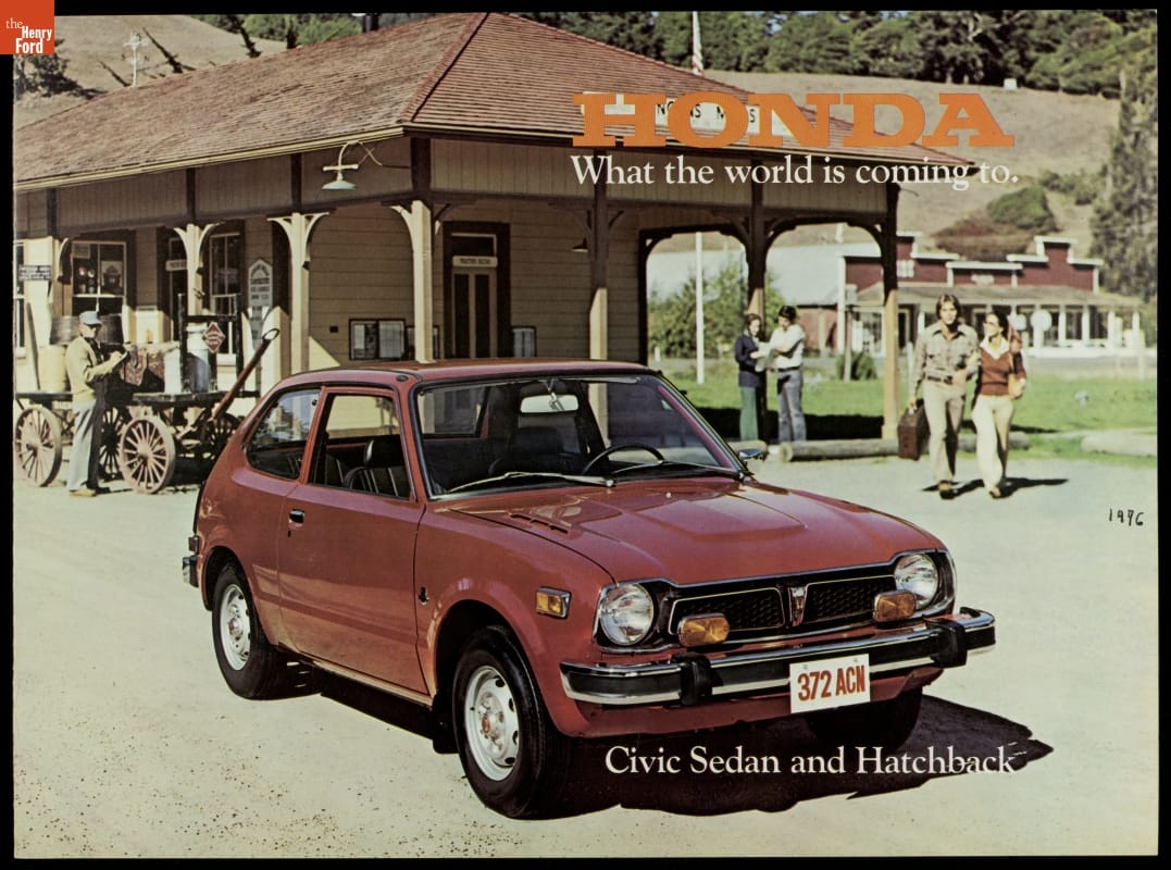 1977 Honda Civic Sedan and Hatchback, "What the World is Coming To" Page with text and photo of small red/brown car parked in front of a wooden building with people and a carriage nearby