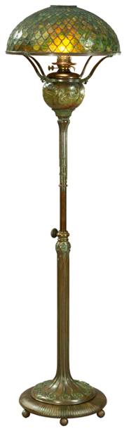 Floor Lamp, circa 1900 Lamp with bronze base and stem, and green and yellow "fishscale" patterned glass shade