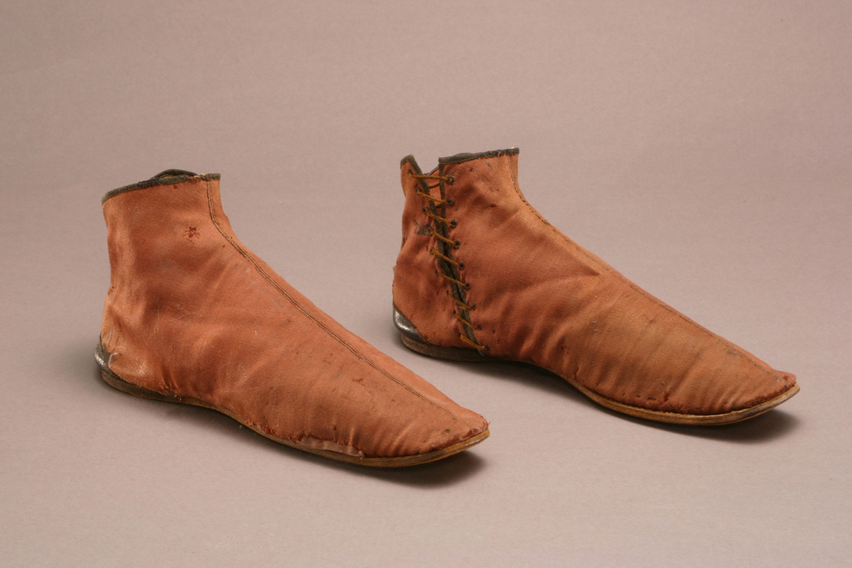 Simple brown booties with seam up center and laces on inseam