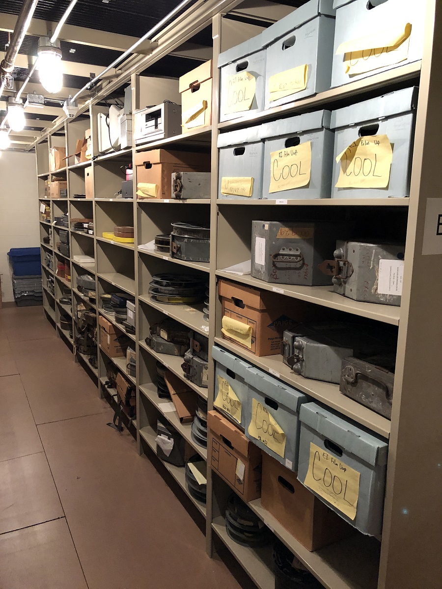 Shelves containing a variety of labeled archival boxes