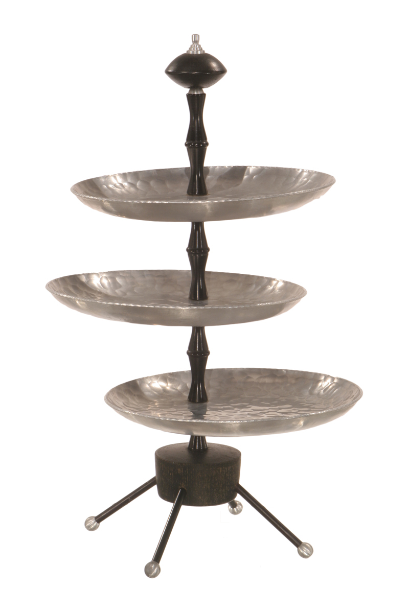 Tiered tray with tripod base, black center rod and three silver trays extending from it