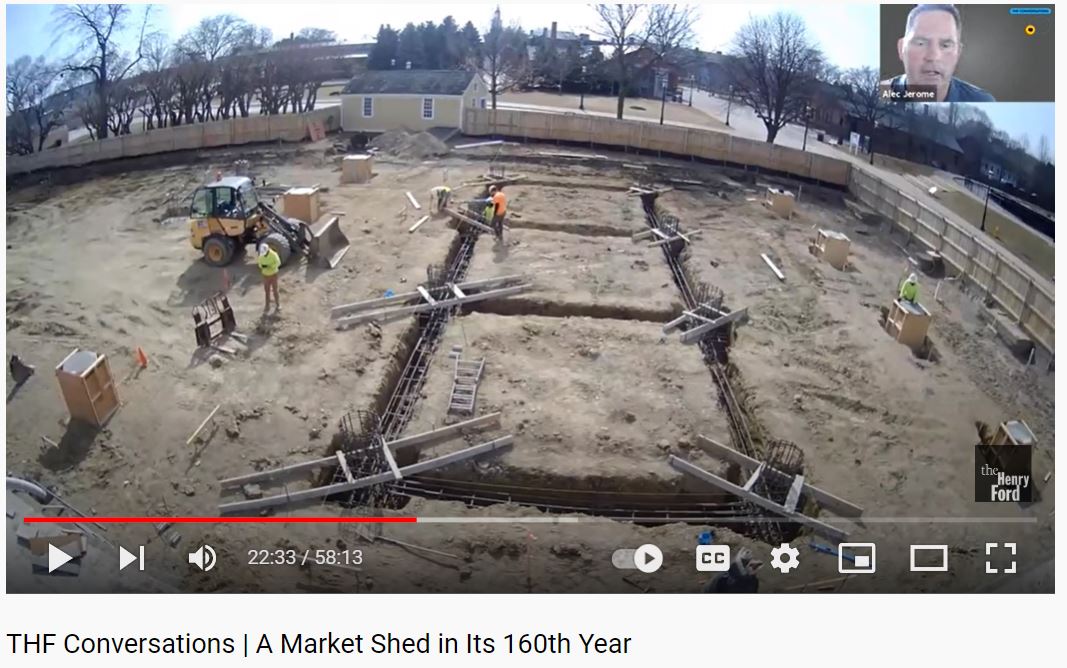 Screenshot from presentation about Detroit Central Market Video screenshot showing a construction site; small "zoom" box in upper right with face of person presumably presenting