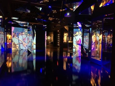 Mirrors in Dr. Strange section of "Marvel: Universe of Super Heroes" exhibition Dark room with illuminated images at various angles