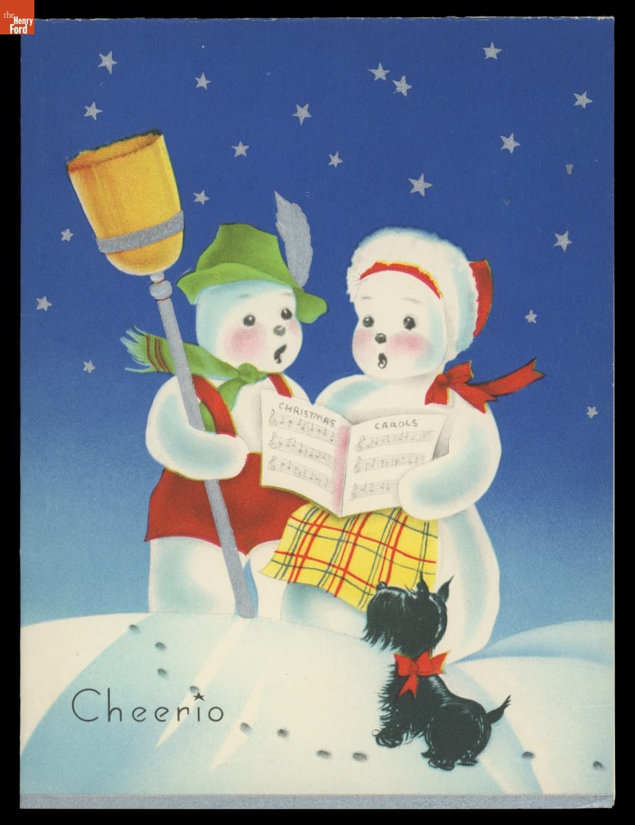 Christmas card of two snowpeople singing from sheet music against a blue sky filled with stars as a black Scottie dog looks on