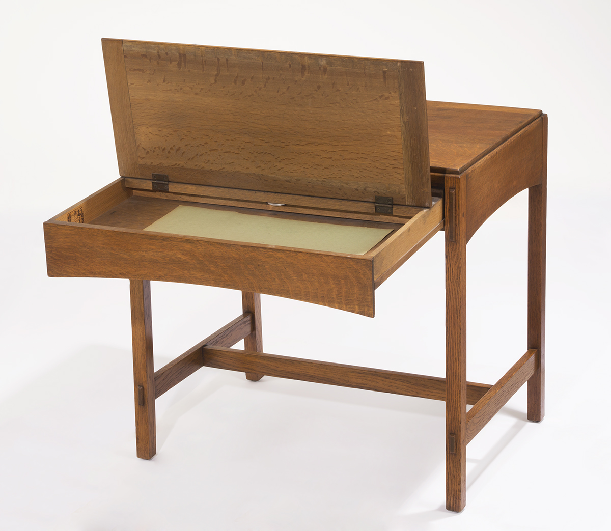Limbert Library Table, 1905-1915, open to show storage space Wooden table with top extended and hinged open to reveal storage space inside