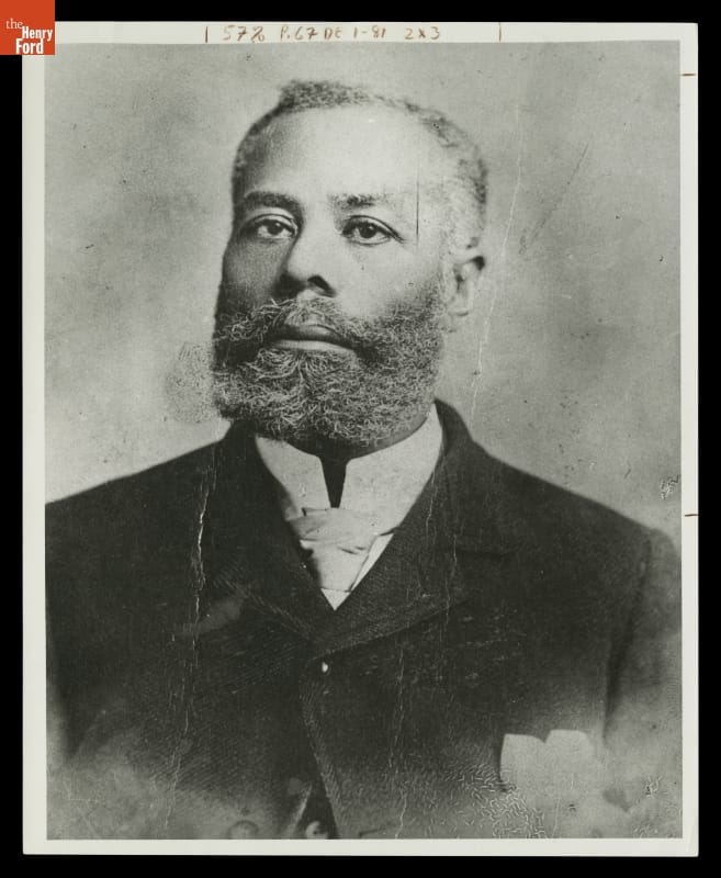 Portrait of man with beard and mustache wearing suit
