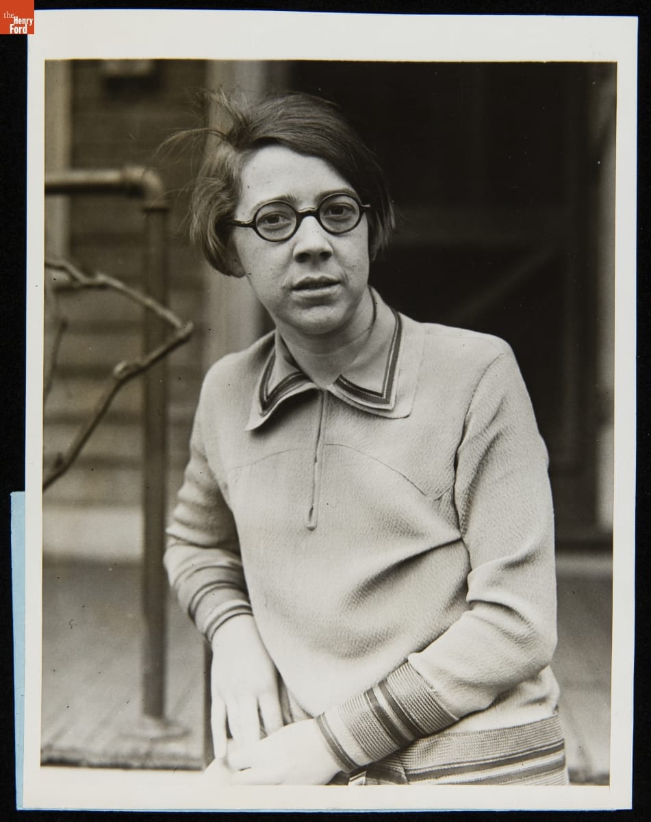 Dorothy Nickerson of Boston Named United States Department of Agriculture Color Specialist, March 30, 1927 Woman with bob wearing round glasses in front of a porch
