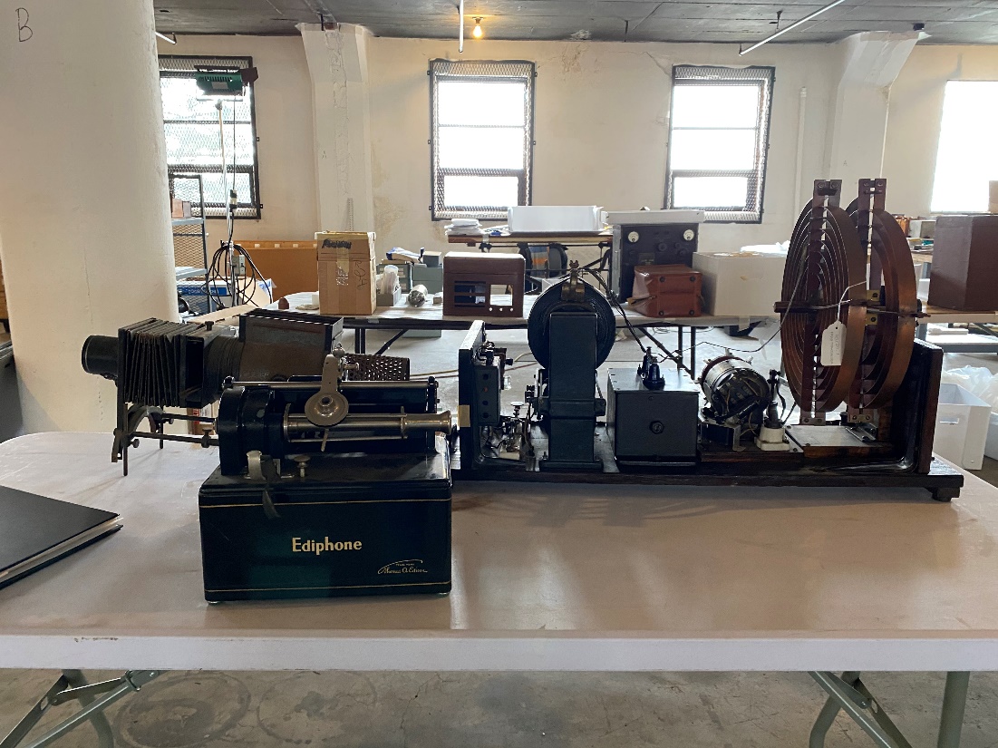 A variety of large equipment sits on tables in a large room