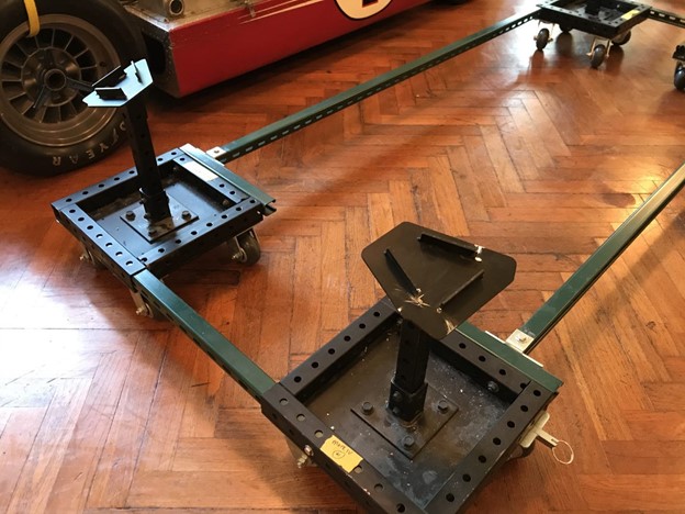 Metal frame on casters with widgets at each corner