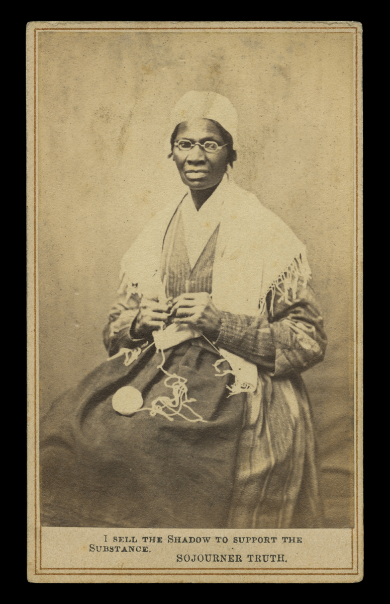 Sepia portrait of African American woman in a dress and shawl seated in chair, knitting, with text at bottom “I sell the shadow to support the substance – Sojourner Truth”