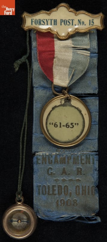 Grand Army of the Republic (G.A.R.) Forsyth Post at the 1908 Toledo, Ohio National Encampment Badge Blue ribbon containing text; topped with red, white, and blue ribbon with round metal piece containing text