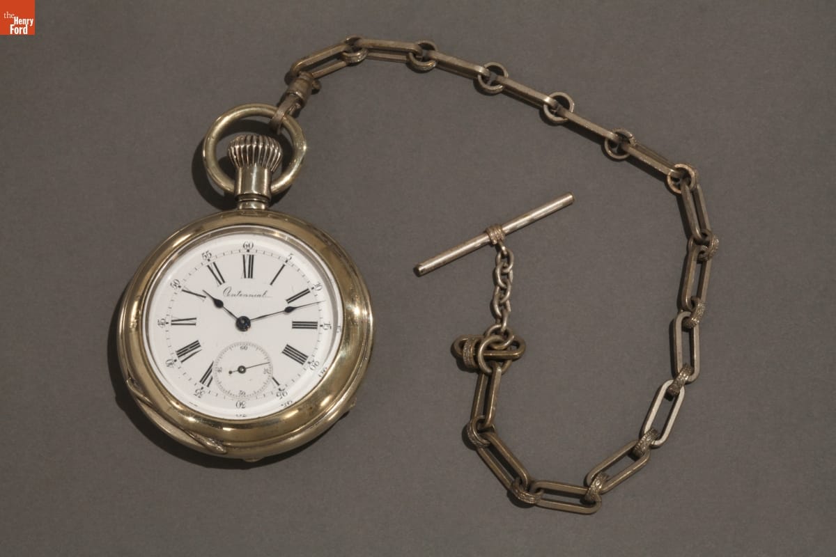 Silver pocket watch with attached chain