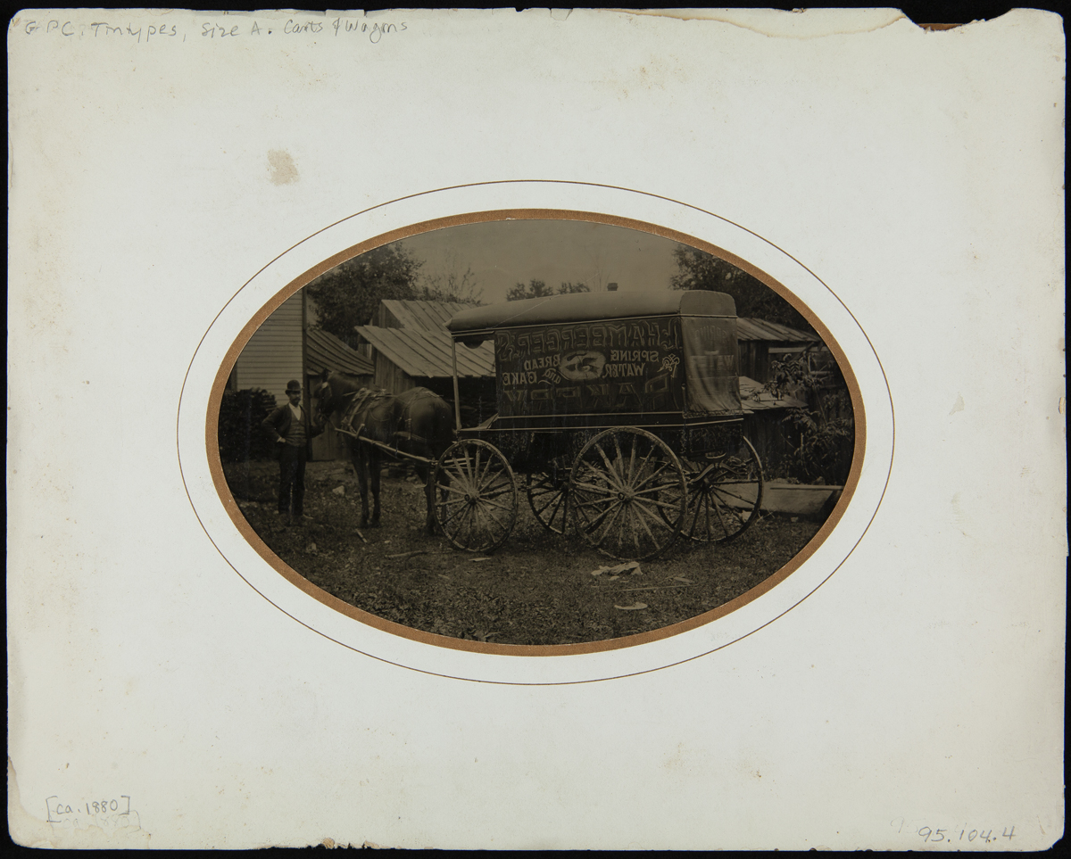 White mat with oval image of man with horse and wagon