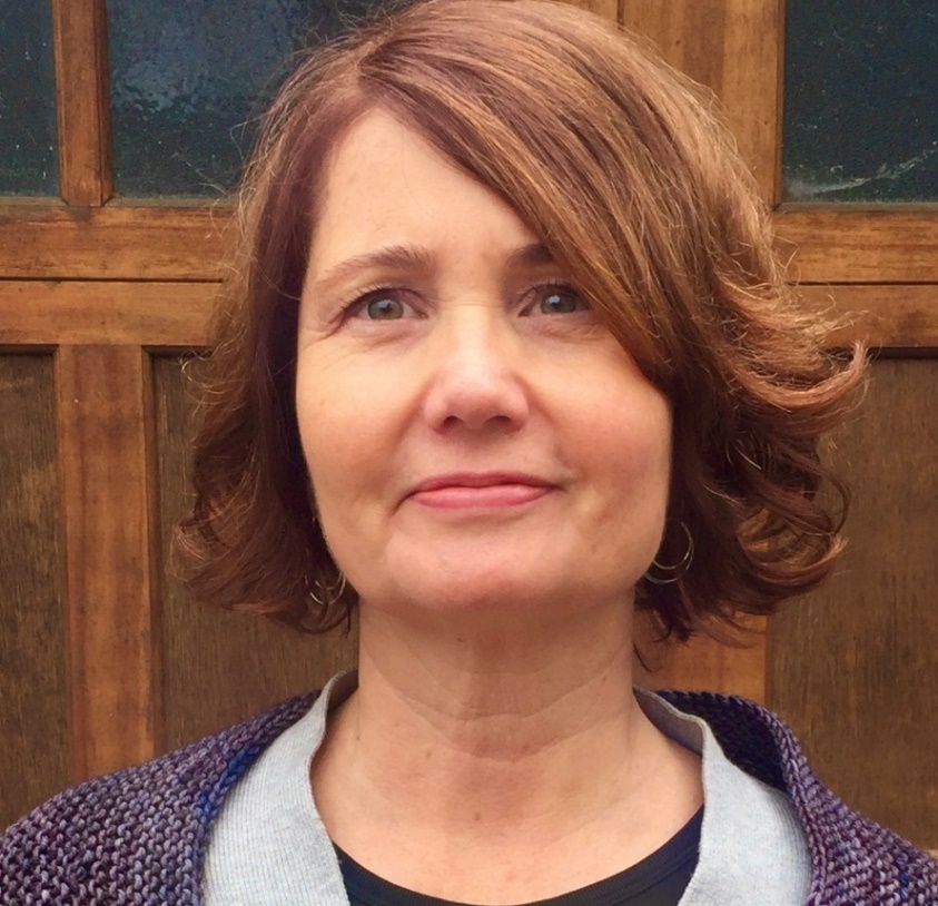 Light-skinned woman with brown hair