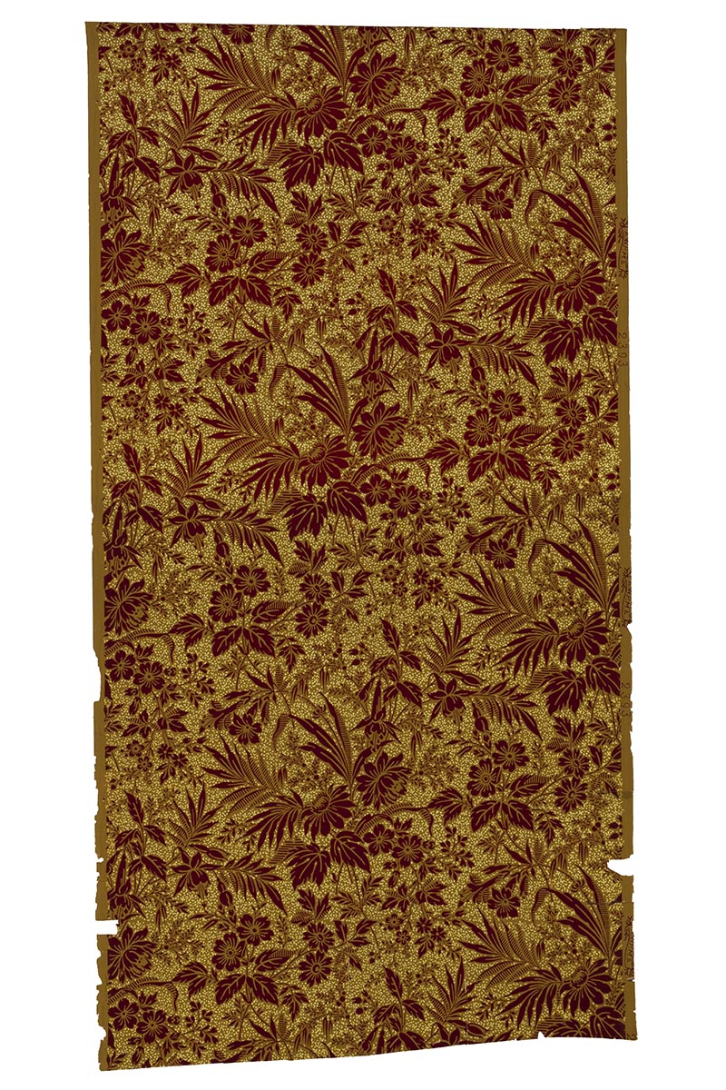 Rectangle of wallpaper with pattern of maroon foliage and flowers on a gold background