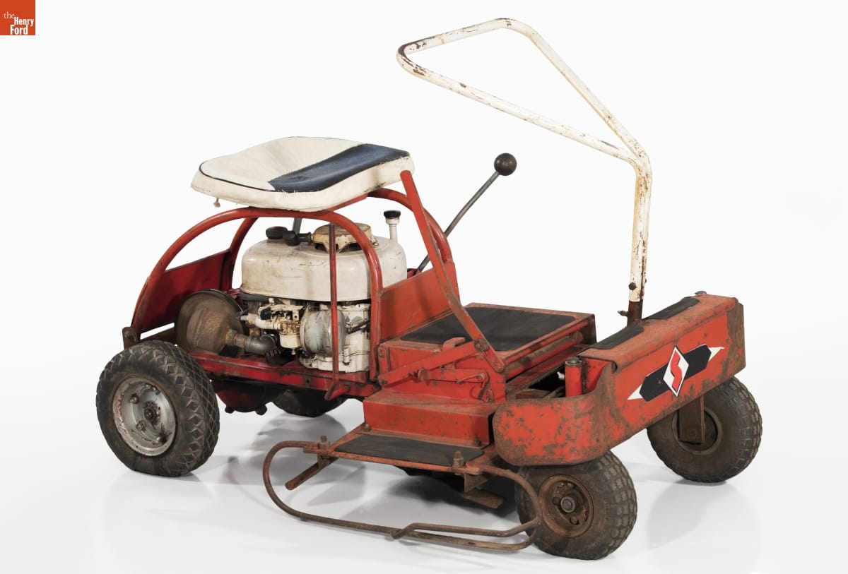 Simple red riding lawnmower with white seat and triangular handle