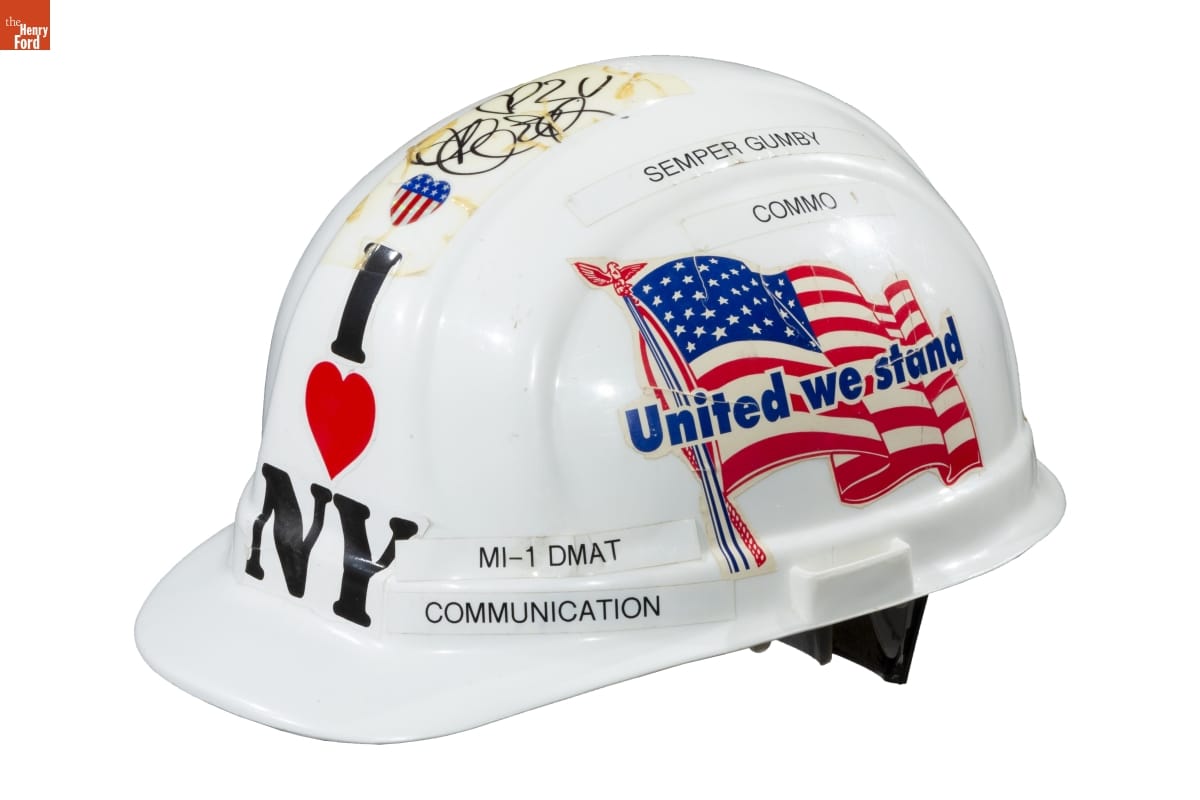 Hard Hat, Worn by Gerald Gomes While on Assignment at Ground Zero, September 2001 White hard hat with text, decals, and handwriting on it