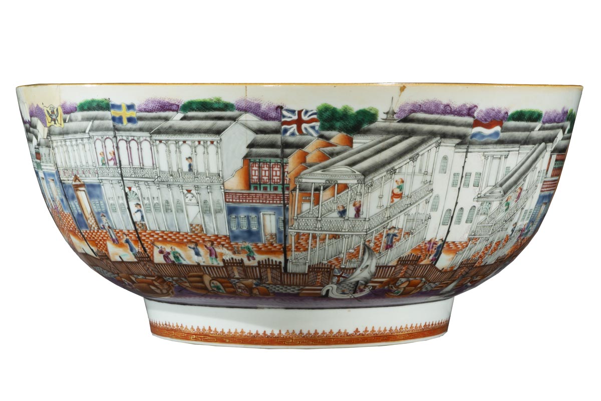 Short-ish bowl with wide base and even wider sides, decorated with a wharfside scene of buildings, people, docks, boats, and water, with the Union Jack flying in the middle