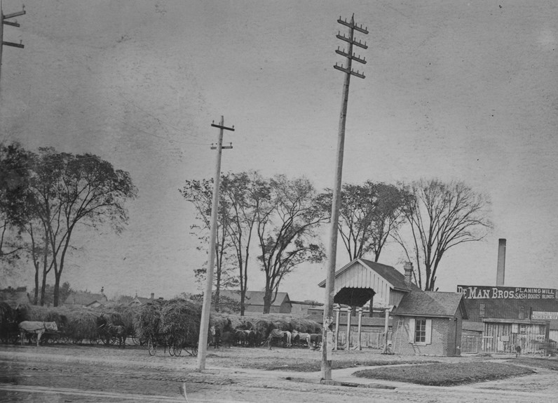 Hay market with scales, likely located at Trumbull and Cherry Streets, Detroit, 1880-1890.