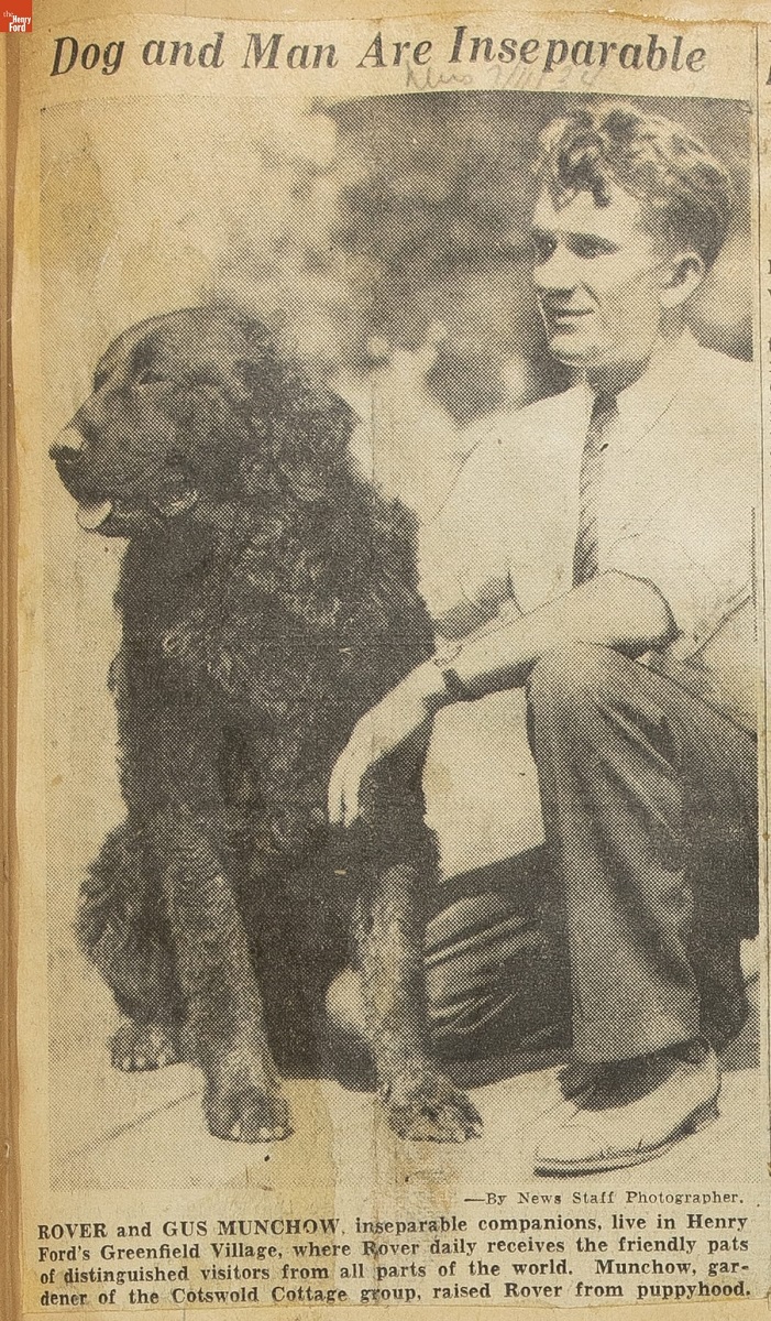 Ford Motor Company Clipping Book, Volume 88, April-November 1934 / detail 1 Newspaper clipping with photo of man kneeling next to seated large black dog; also contains text caption