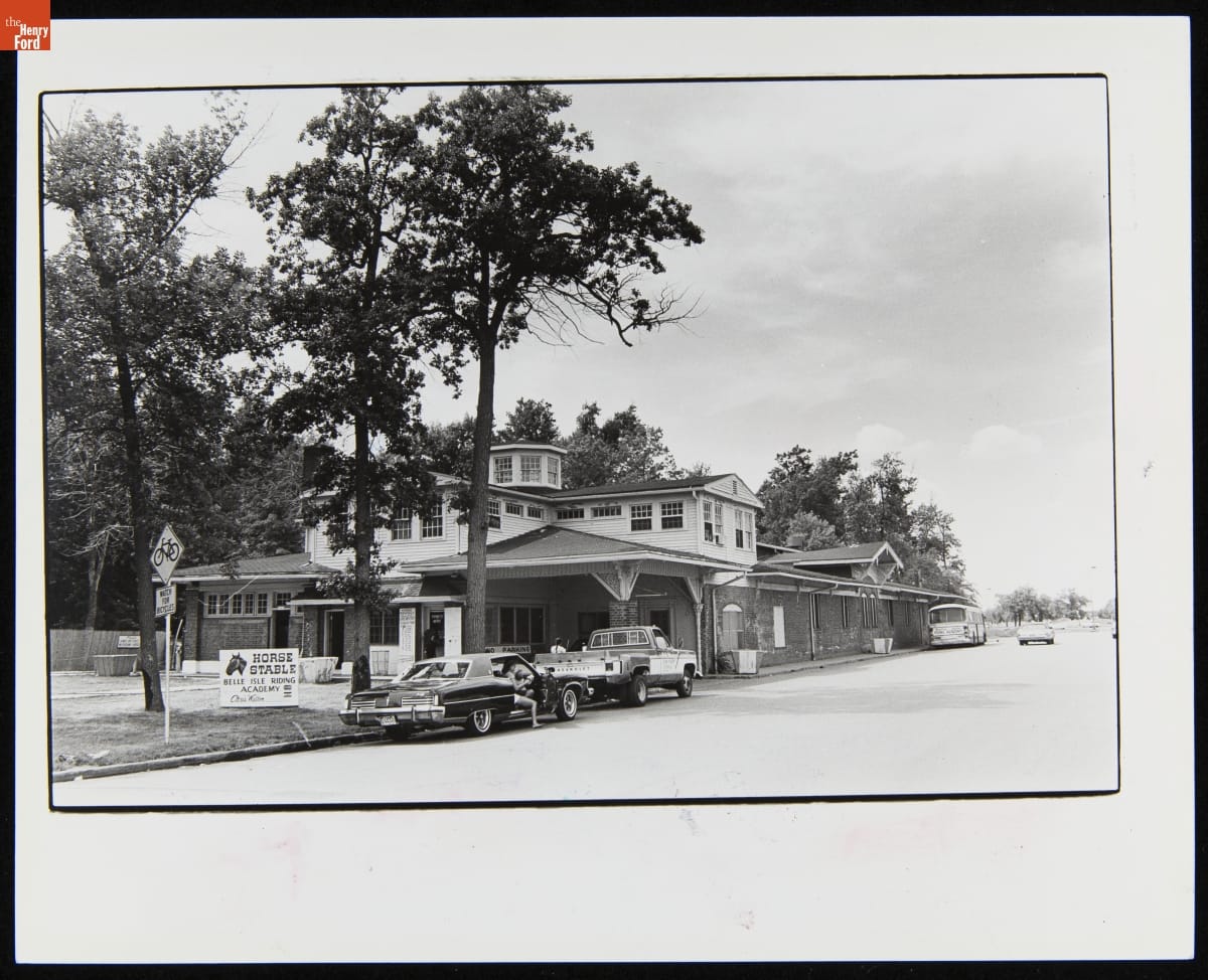 Horse Stable on Belle Isle, Detroit, Michigan, July 27, 1978 Elaborate two-story building with cars parked along street in front