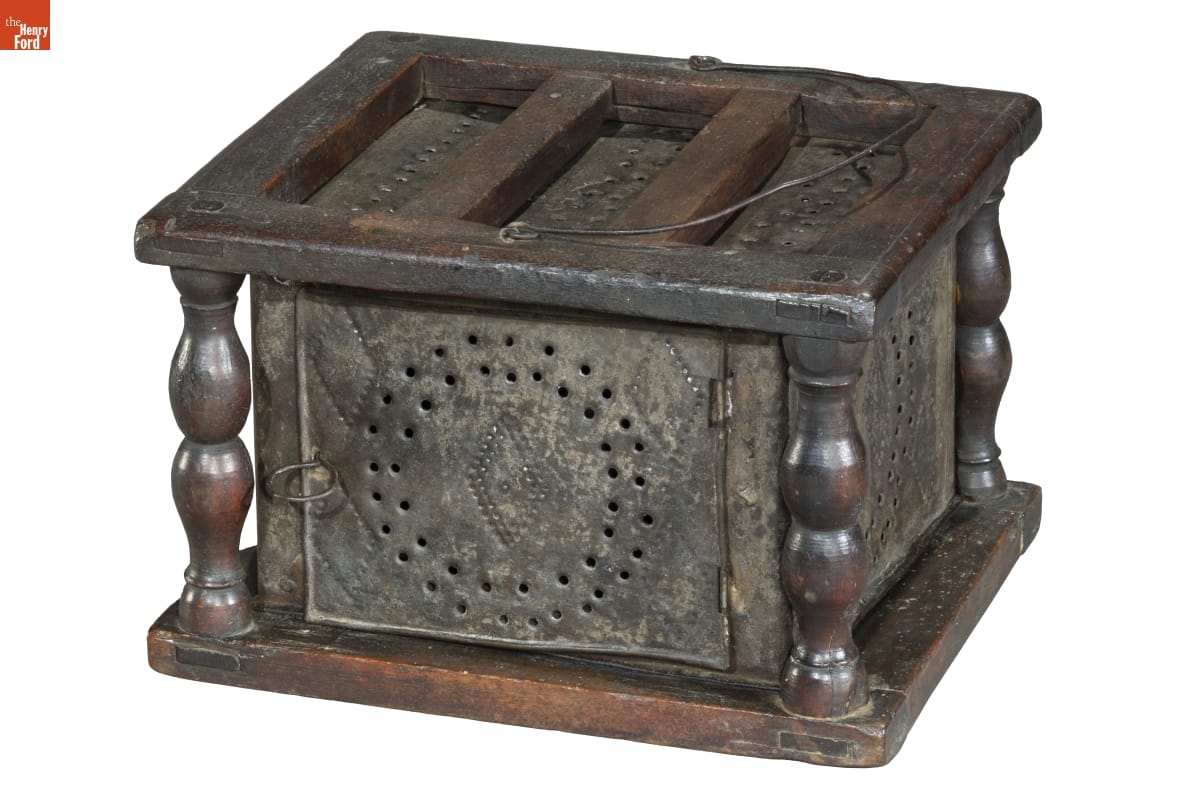 Metal box with perforations and decorations on sides and top
