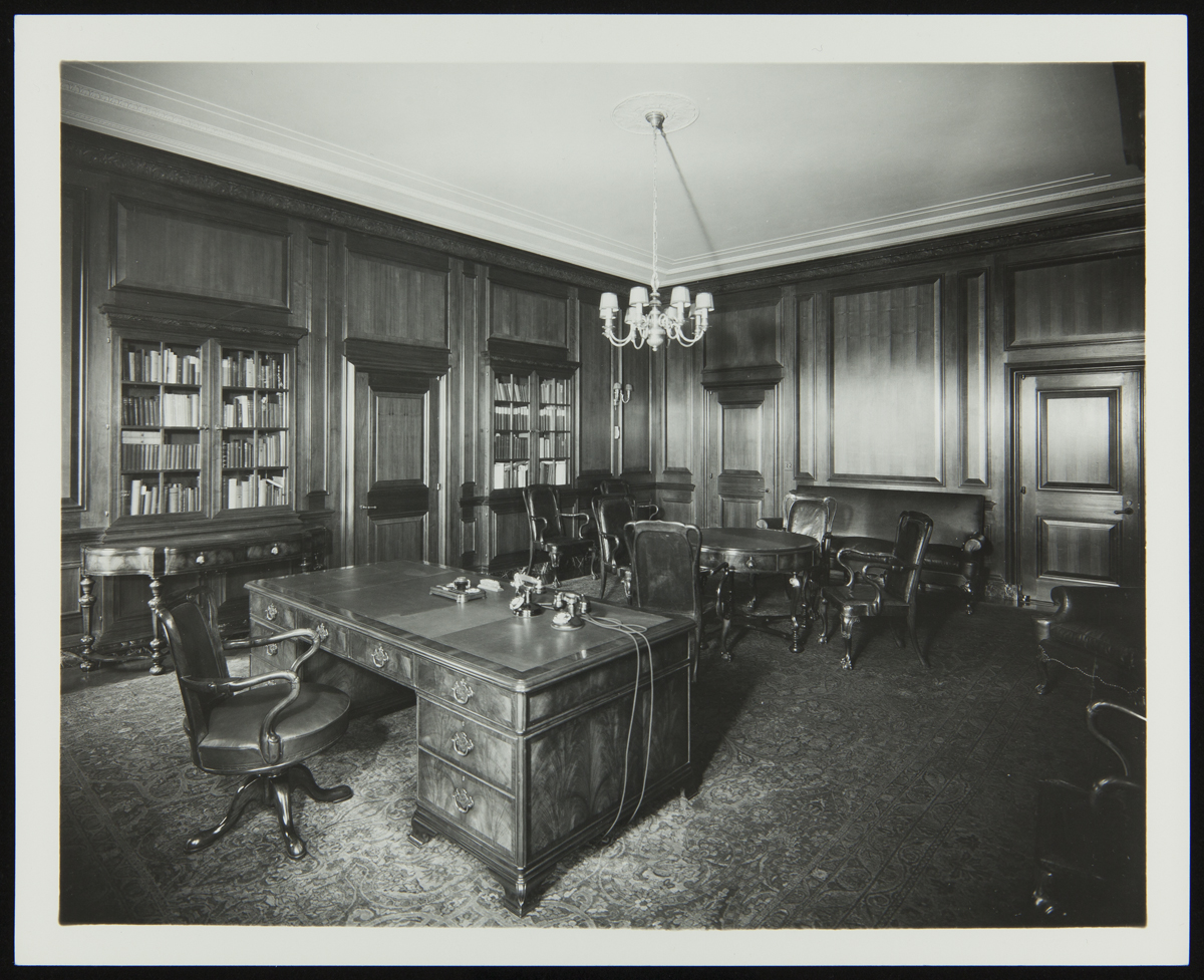 Henry Ford's Office, Ford Engineering Laboratory, circa 1924 Interior of office with wood paneling, wooden furniture, and built-in bookshelves