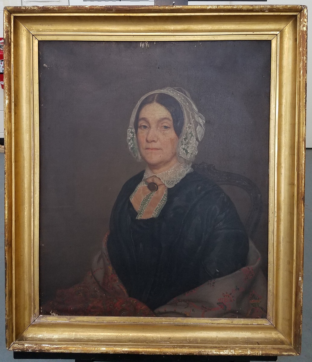 Painting of woman in black dress, shawl, and lace bonnet in gold frame
