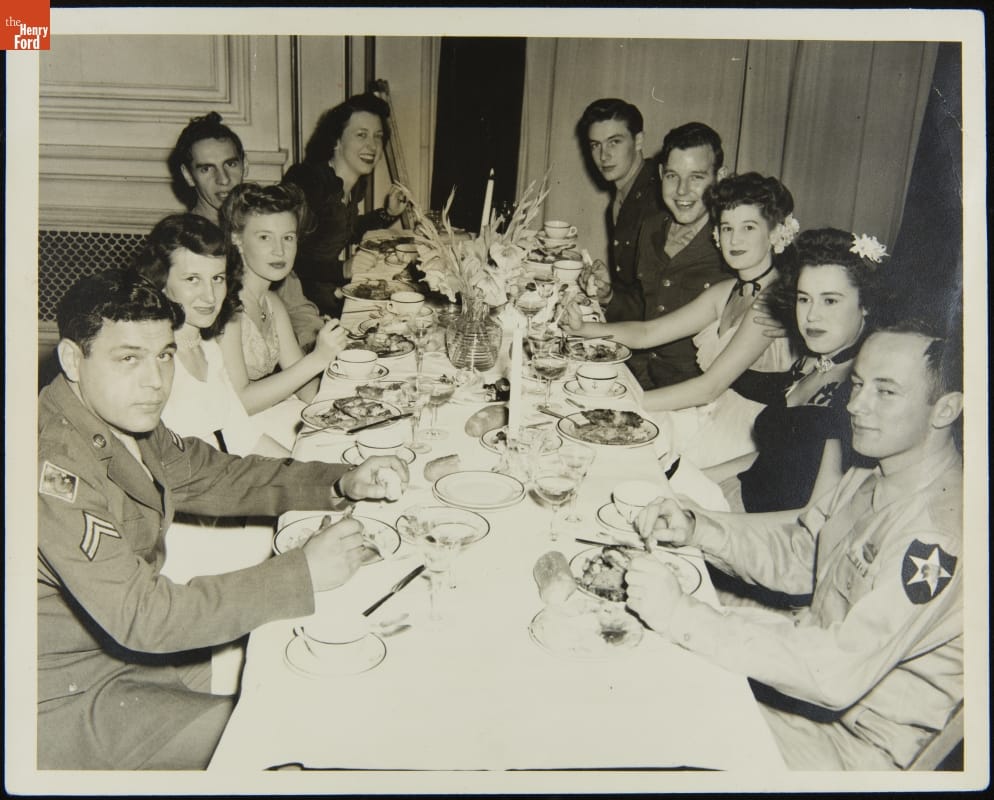 AFL-USO Dinner for Percy Jones Hospital Veterans, Detroit, Michigan, May 1945 Group of men in military uniforms and women in dresses sit at a long dinner table
