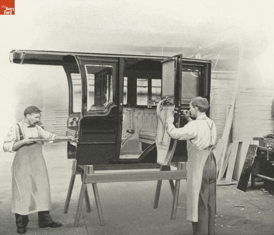 "The Rambler Magazine," Number 49, 1911 / inside Two men work on a car body on sawhorses