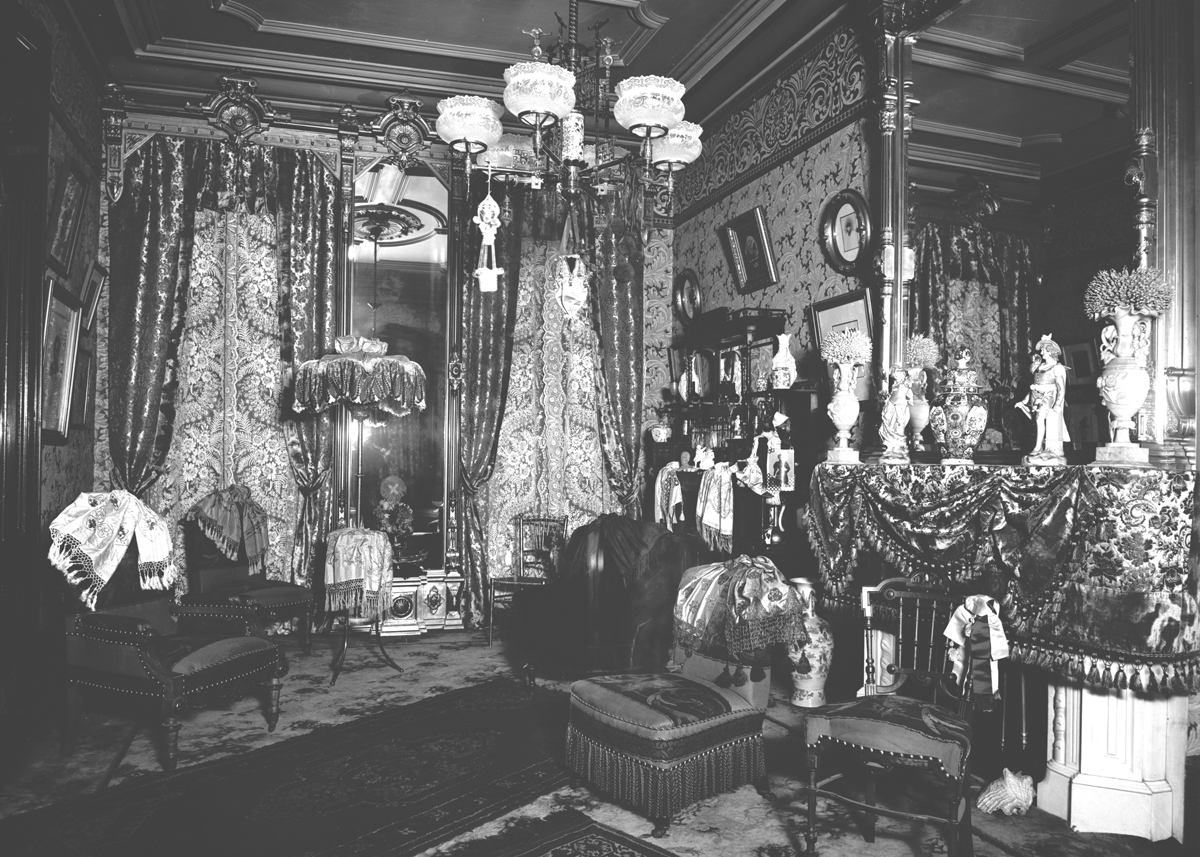 Room Interior, 1890-1915 Room crowded with furnishings and drapery
