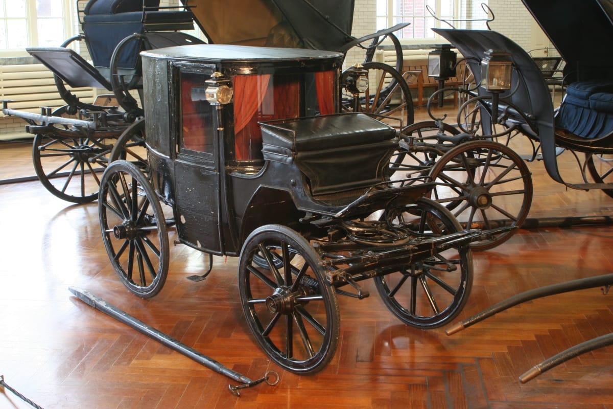 Small enclosed black carriage