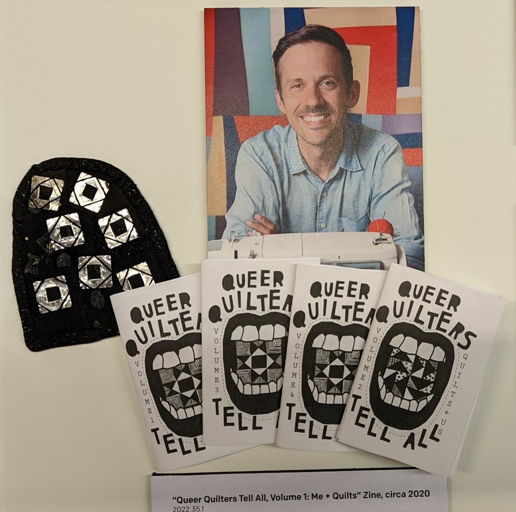 Photo of man, arch-shaped fabric with shiny silver squares, and four booklets with graphic of mouth with teeth and text