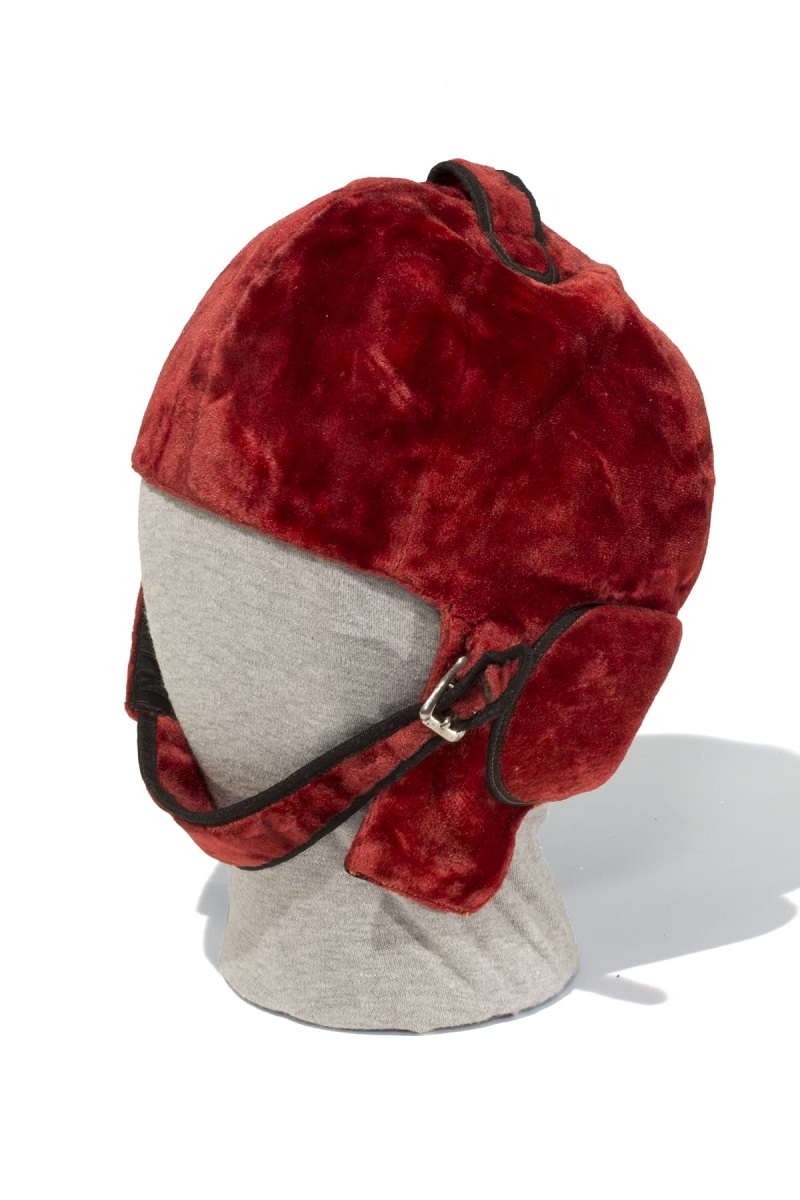 Red velvet helmet with chin strap and buckle