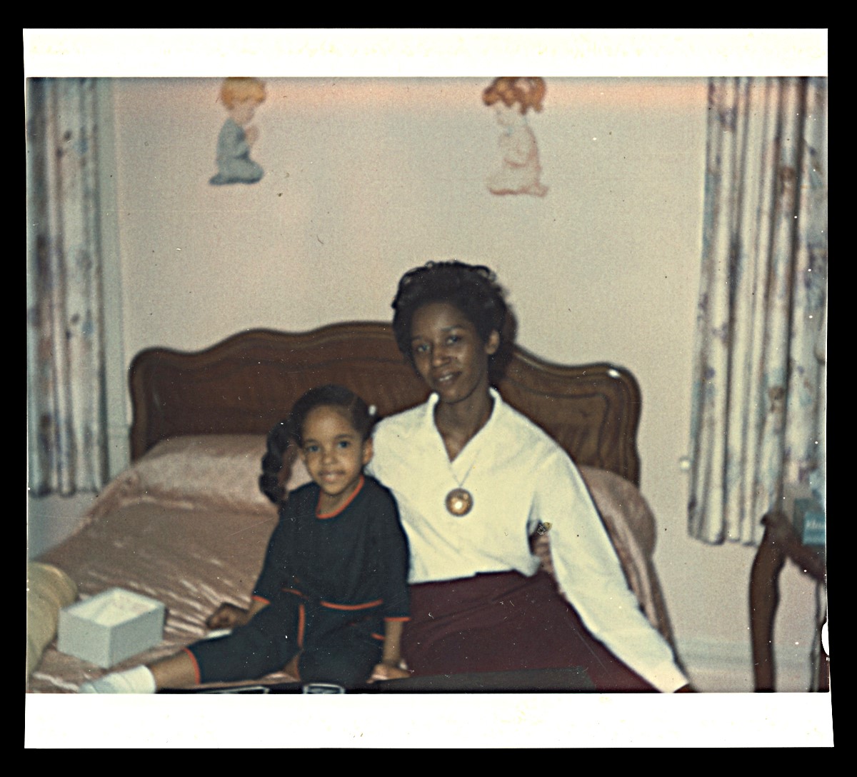 Jawana Jackson (with a babysitter) in her bedroom, about 1968.