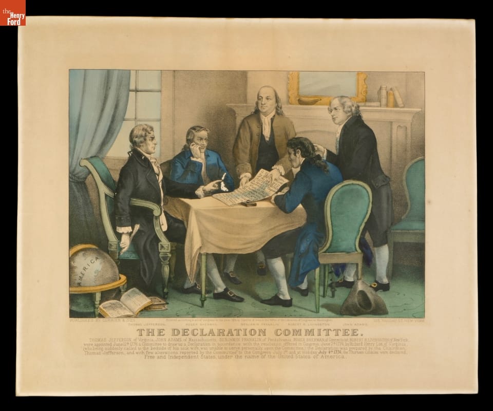 Print of five men gathered around a table on which is a large document; also contains text